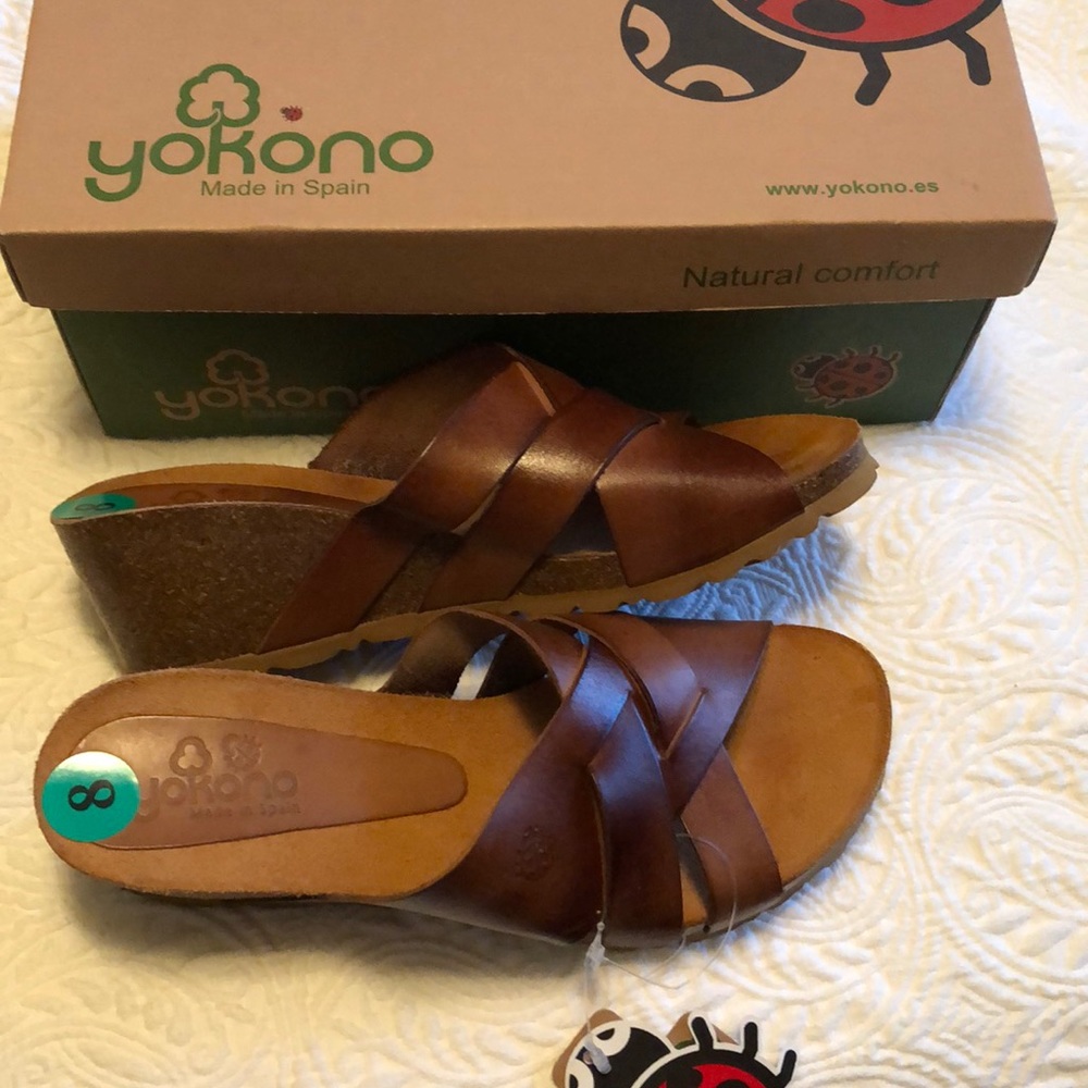 Wedge sandals with cork heels and leather straps